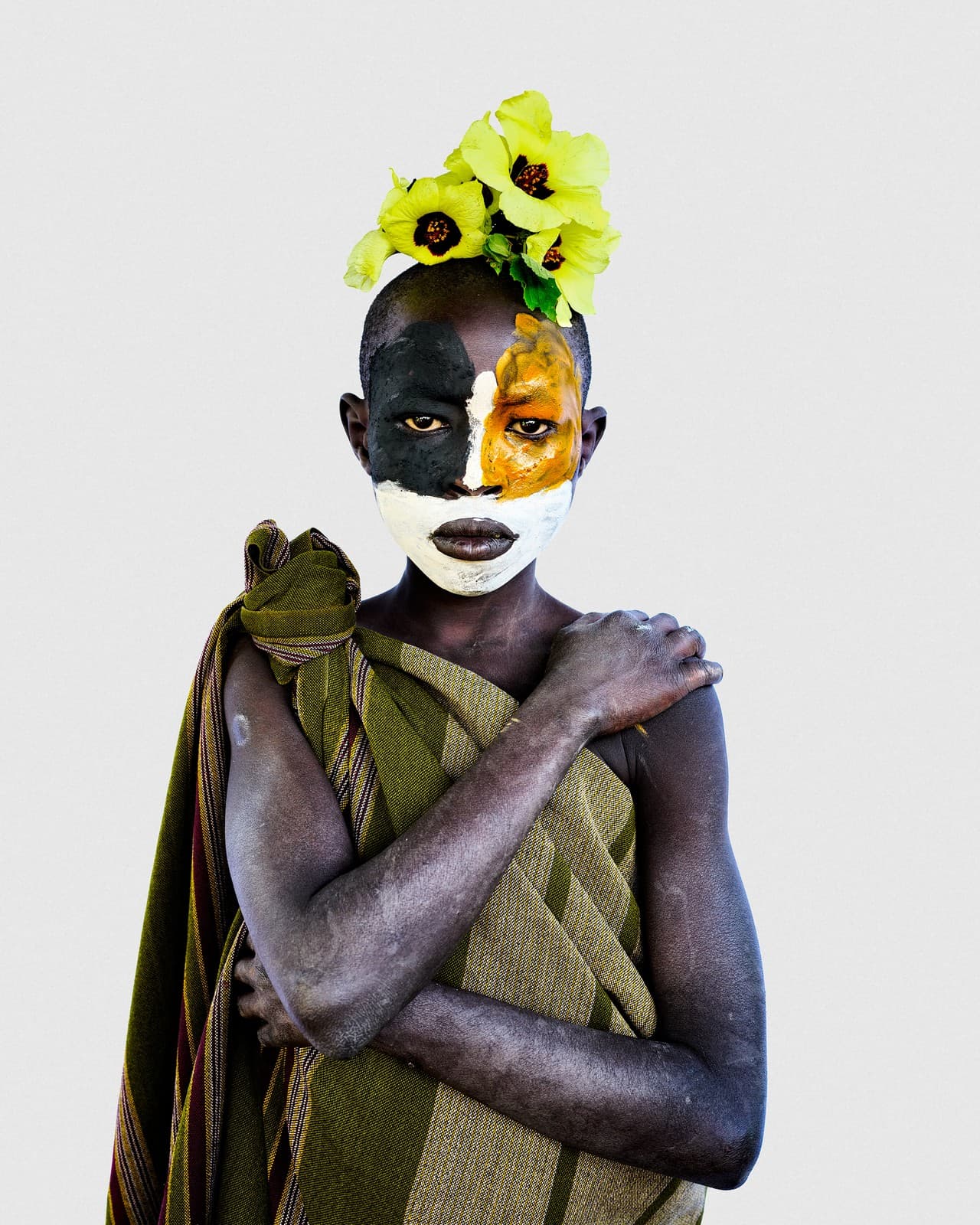 Young person with face paint, Suri community
