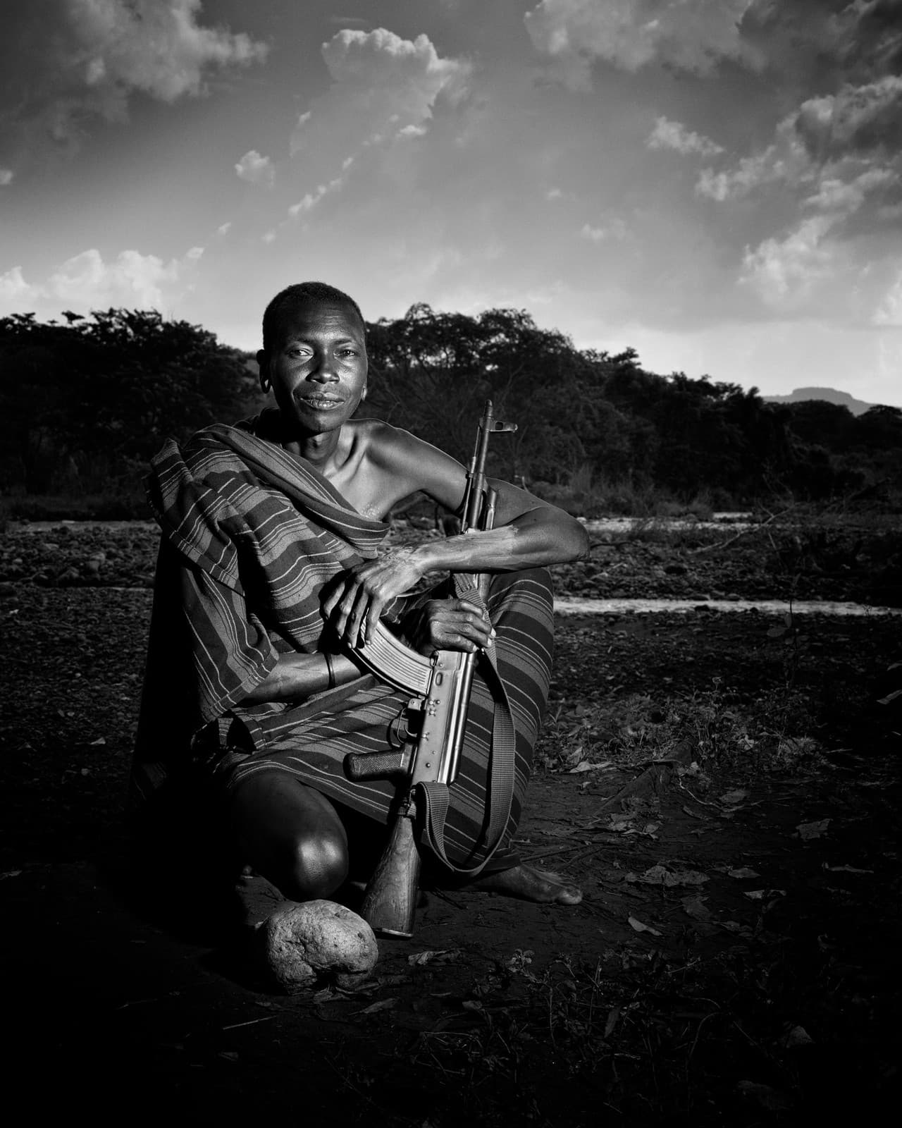 Man with rifle, Suri community